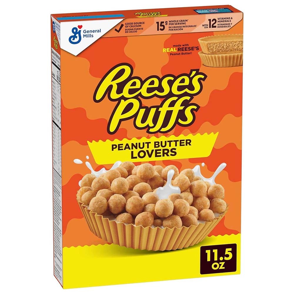 Un carton orange sur fond blanc avec un bol en forme de Reese's cup rempli de petites boules beiges